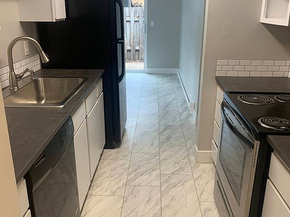 Kitchen w/ dishwasher (replacement cabinet door on order)