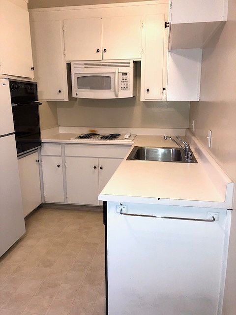 Kitchen has Microwave and Dishwasher.