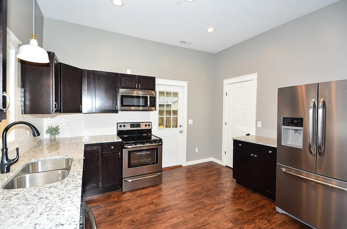 Photo 2 of 22 - 1449 Fletcher Ave - Indianapolis, IN Kitchen with stainless steel appliances and ample storage - 1449 Fletcher Ave
