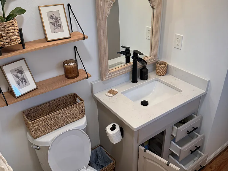 Master bath - storage vanity as well as wall shelving
