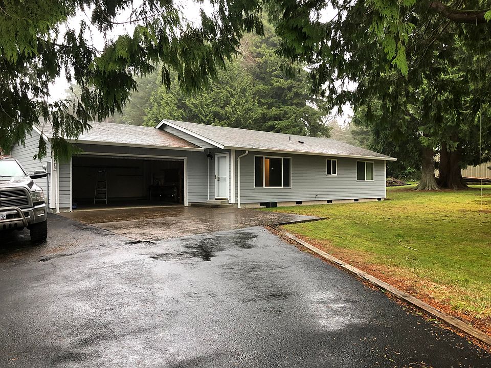 Front view, attached two car garage and driveway.