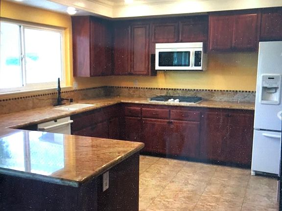 Updated kitchen with large double oven. Nice pantry and additional cabinetry located to the right.