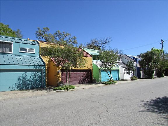 This fantastic row of homes was designed & built by 3 Rice University Professors, Each one bright and cheery with their own indi