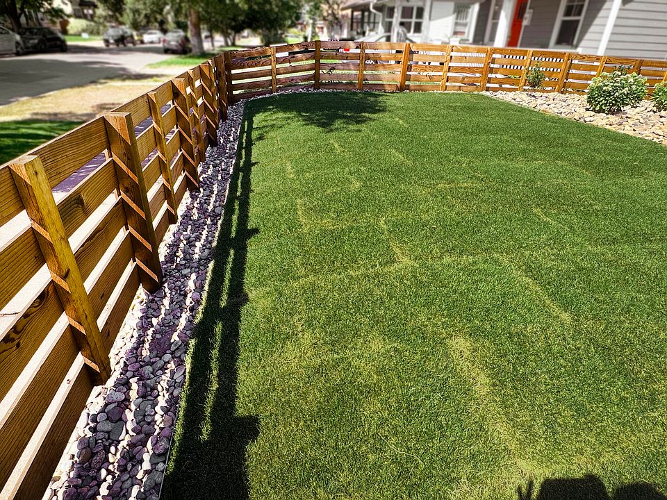 Front yard - NEW sod lawn with automatic sprinkler system and fencing