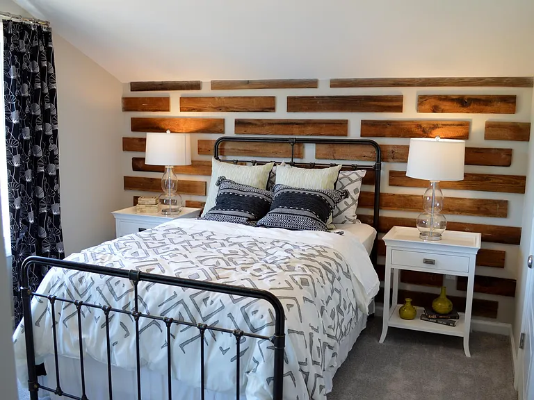 The second bedroom has a lovely wood plank feature wall and a large walk-in closet. It also has access to the hall bathroom.