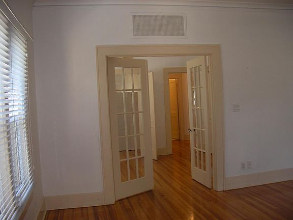Back to front door through living room, dining room looking