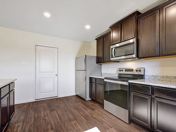 The kitchen comes with a full suite of energy-efficient appliances
