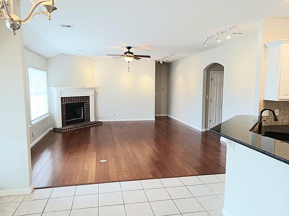 Open Floor Concept - Living, Kitchen, Dining, track lighting, gas fireplace