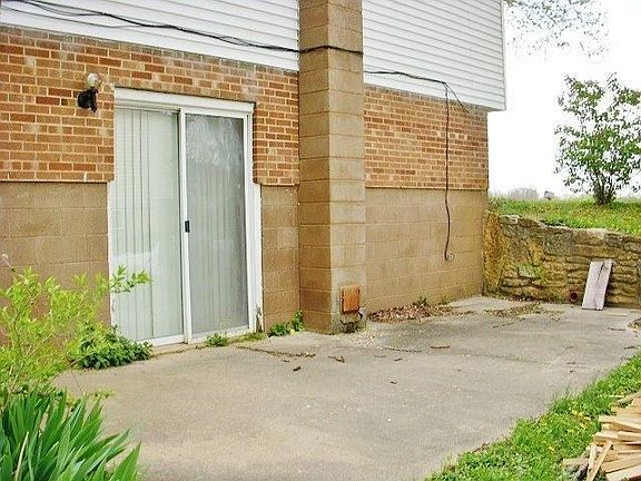 The patio is adjacent to the basement & a great place to sit & enjoy the fall evenings.