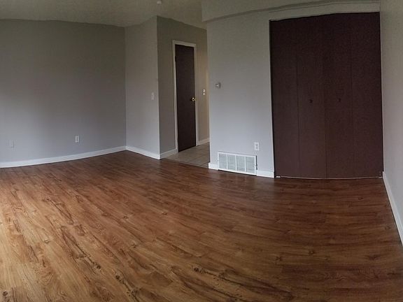 3rd. view of Living Room area, looking toward the hallway between half bath, kitchen and Front Entry.