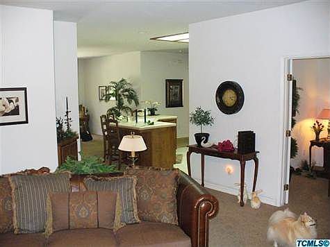 View from living room into kitchen and dining room.