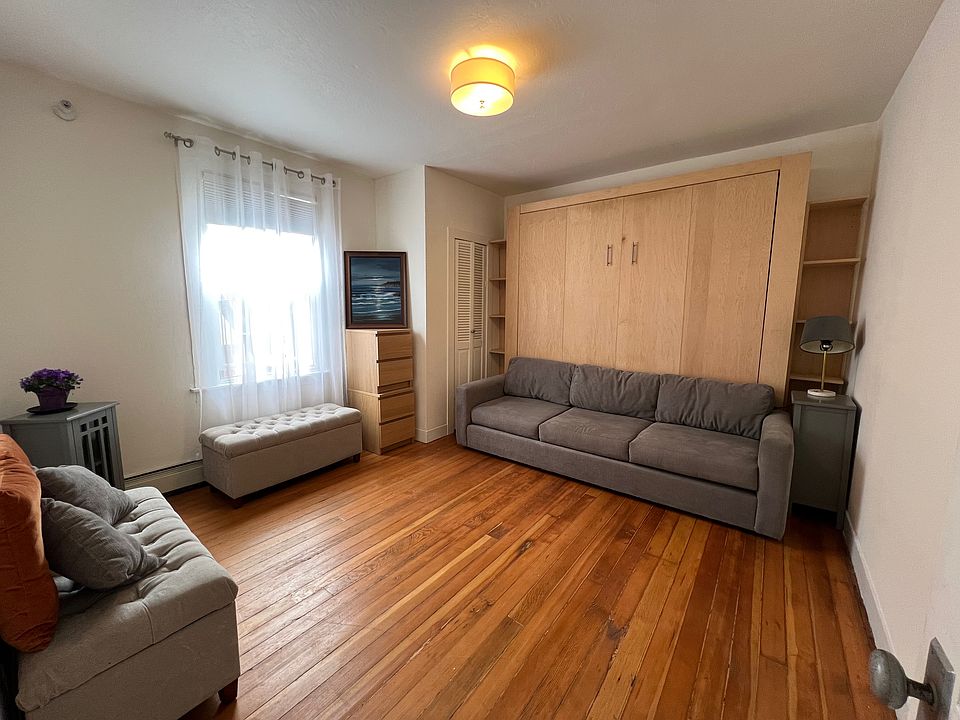 Living and sleeping space with murphy bed and murphy bed couch