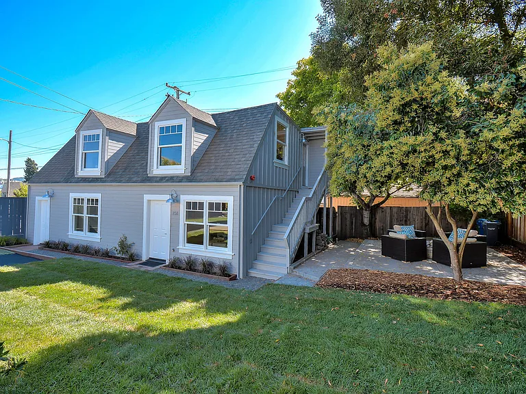 Carriage House with private patio area which was recently fenced in.