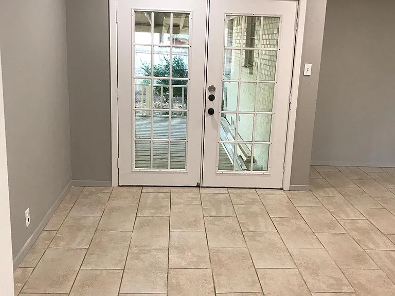 Living room French doors to covered lighted deck