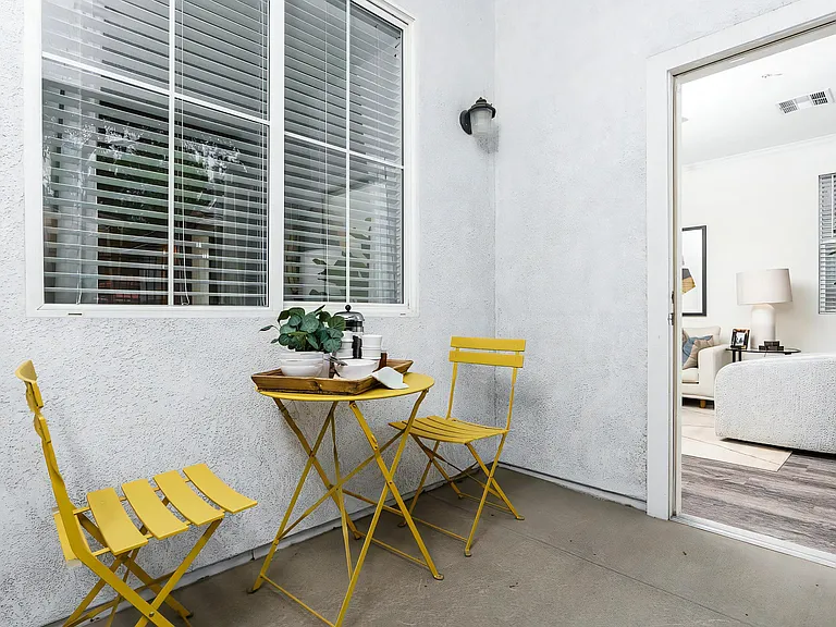 Apartment Patio Space with Modern Outdoor Furniture and Potted Plant