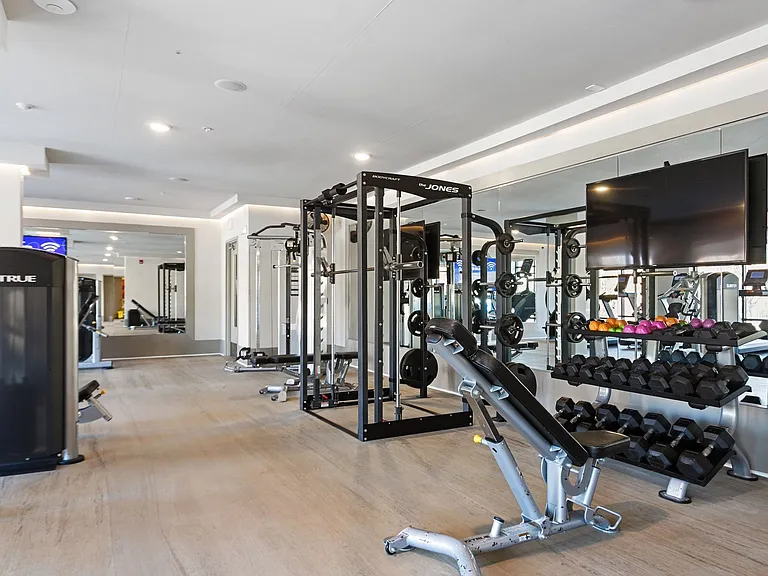 Fitness center featuring cardio equipment