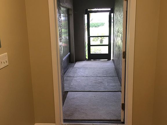 Looking from living room out the front screened porch