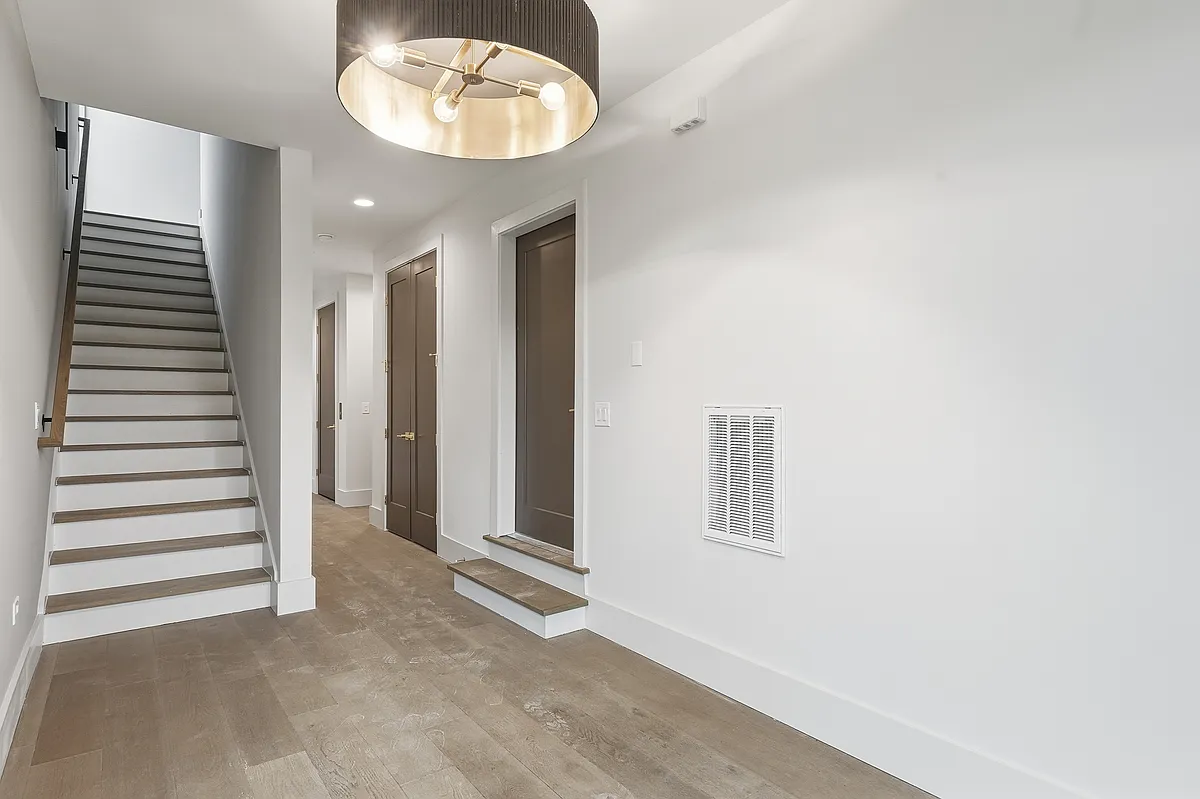 Welcoming entryway with modern staircase and clean design - 3718 W End Ave #6