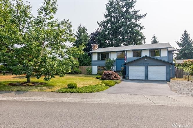 Front of House- Garage & driveway parking included!