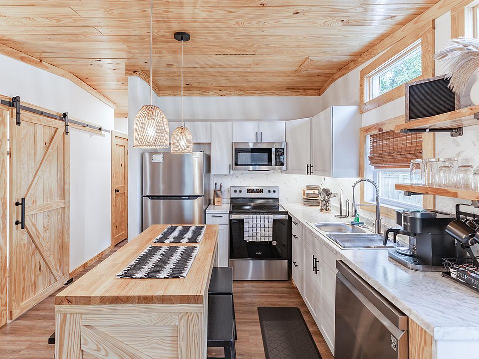 Experience a modern Boho kitchen with abundant space, natural light, and all dining essentials. Find both a Keurig and coffee pot with complimentary coffee.