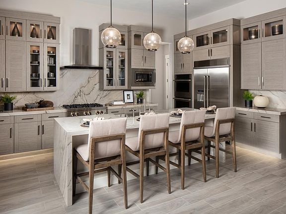 Gourmet kitchen with seating at large center island