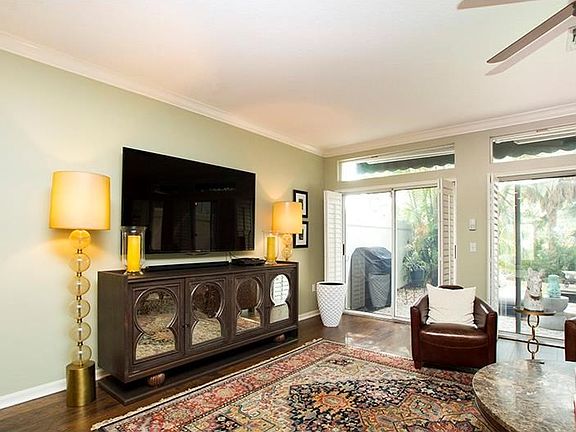 Open and bright living area leads to patio