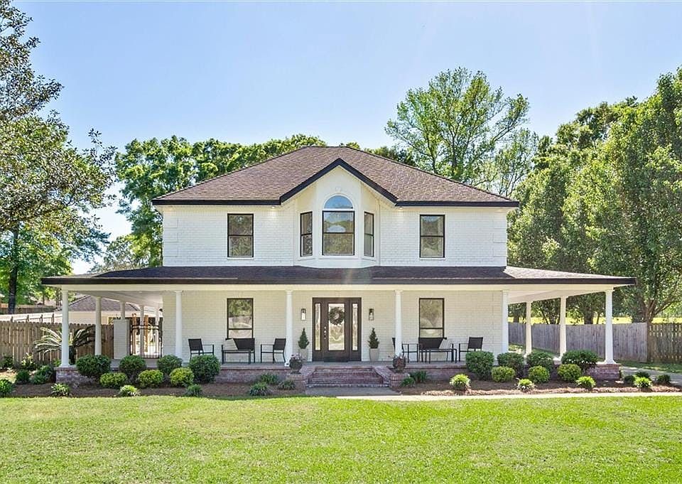Beautiful home on a large lot with a fabulous wrap around porch in a cul-de-sac.