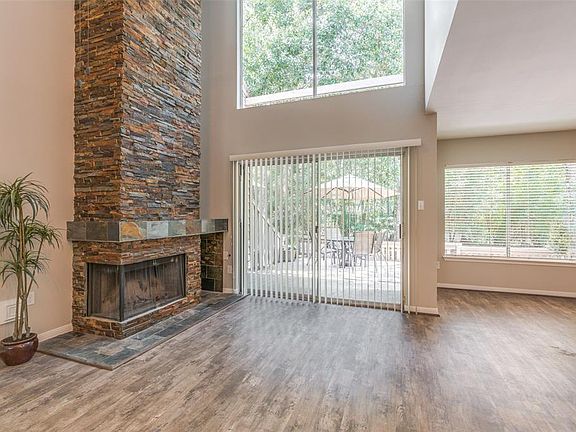 The view looking toward the covered rear patio and the stacked stone fireplace!