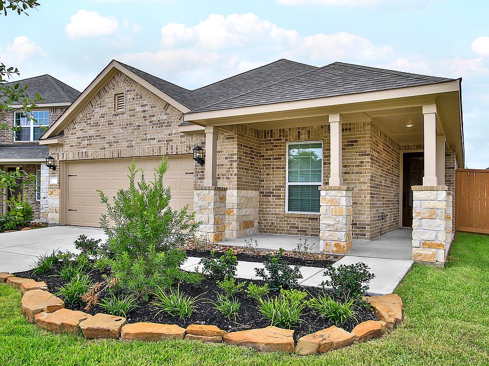 This home has beautiful brick and stone exterior with front yard landscaping