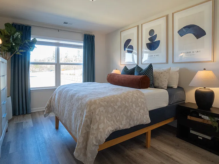 Secondary bedroom on the second floor, with large window and tons of natural light.