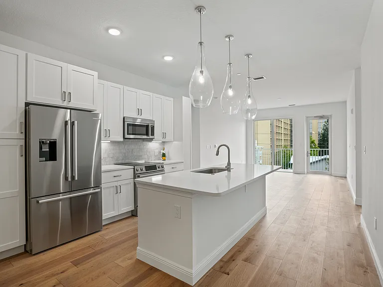 Open concept living, dining, and kitchen area, perfect for entertaining and everyday family living.