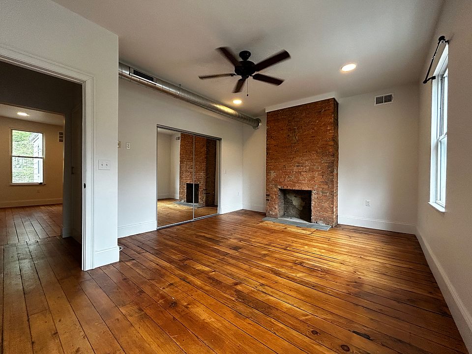 Master Bedroom with decorative fireplace and huge closet