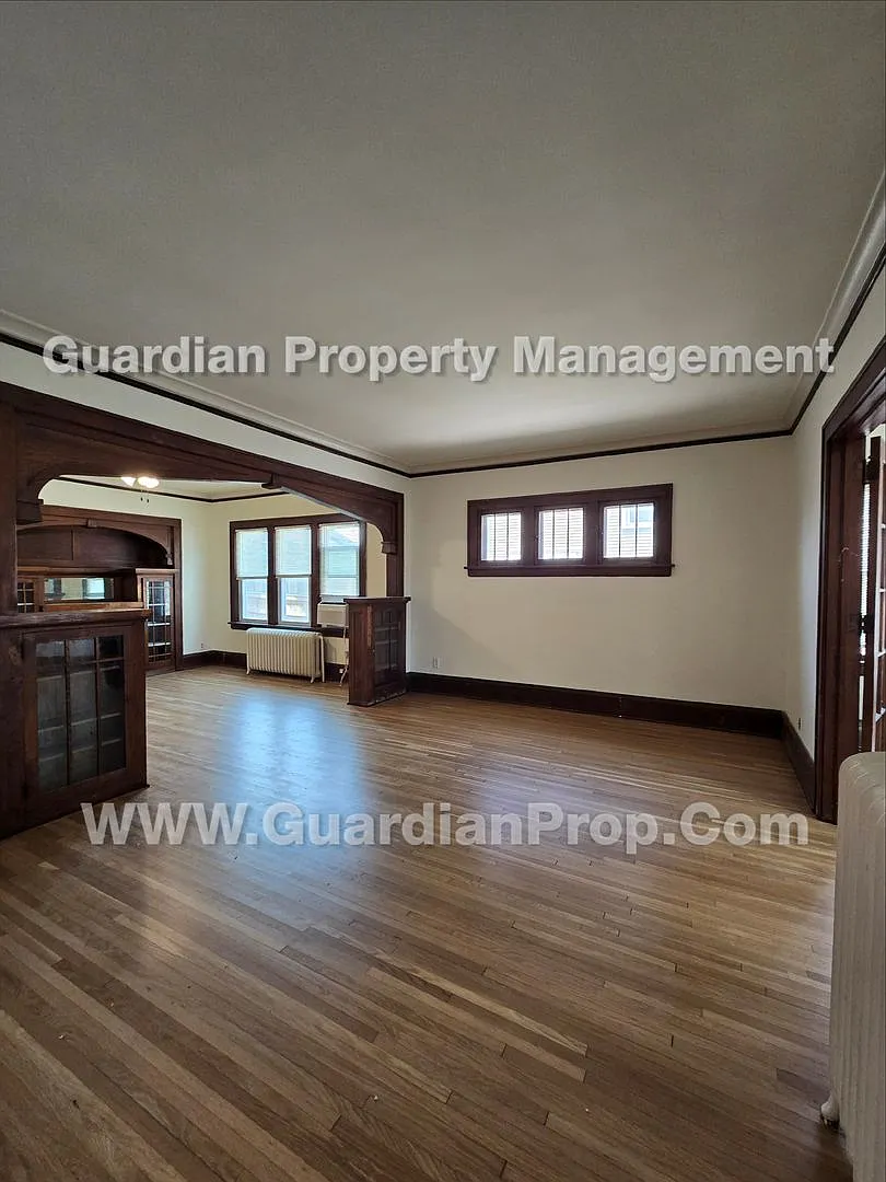 Large main floor duplex unit, Updated Kitchen & Bath, Full Dining Room w/Built-ins + Sunroom, gar... — Photo 3