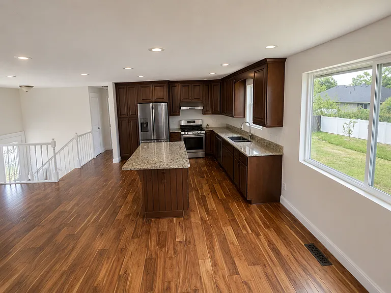 Kitchen with stainless steel appliances and an island with plenty of cabinet space.
