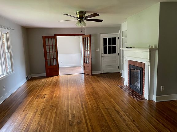 Living Room, with gas fireplace and built-in bookshelves. Ready for your 4D TV.