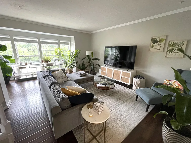 Large family room with wood flooring