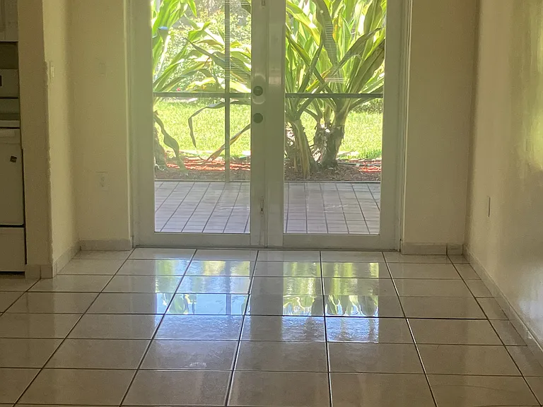 Dining area with partial 12' x 20' screened porch view and patio