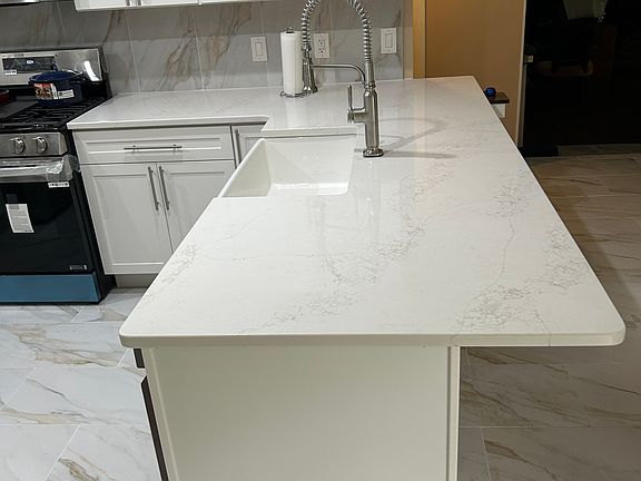 Kohler enamel farmers sink with Kohler Faucet.