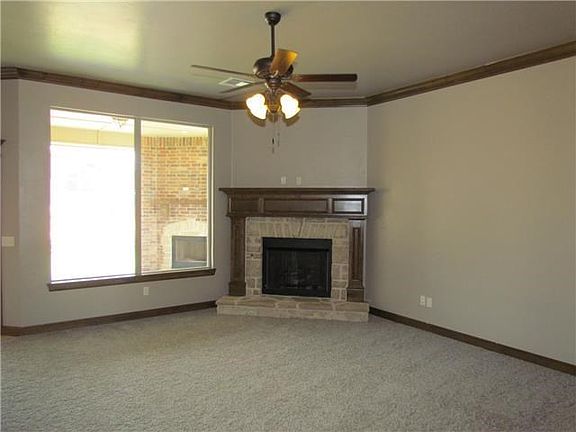 Living Room. LARGE LIVING ROOM WITH GAS LOG FIREPLACE AND LARGE WINDOWS.