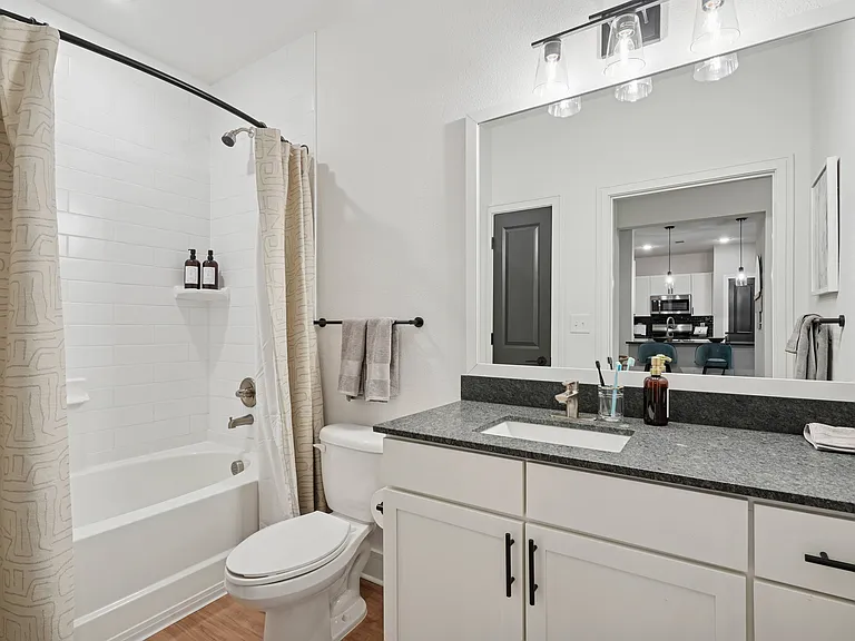 Bathroom with Granite Countertop and Soaking Tub