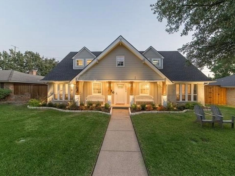Gorgeous exterior with landscape lighting and sprinkler system.