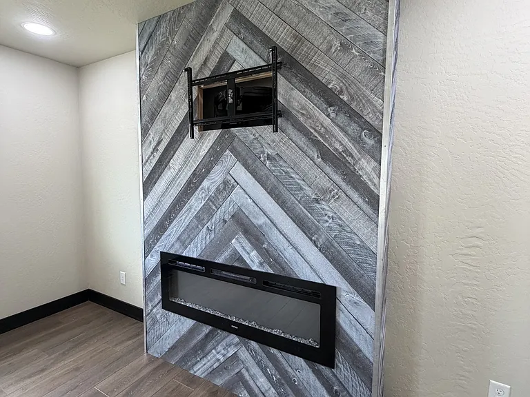 living room fireplace with TV mount above