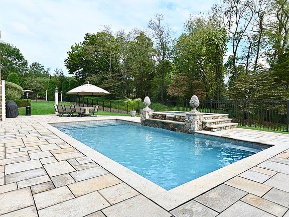 Heated pool with waterfall..