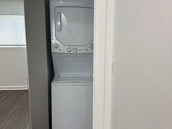 Washer/dryer inside unit.