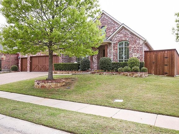 This 1.5 story has curb appeal plus and features extensive exterior stone work, an 8 foot privacy fence and an over sized 3 car garage!