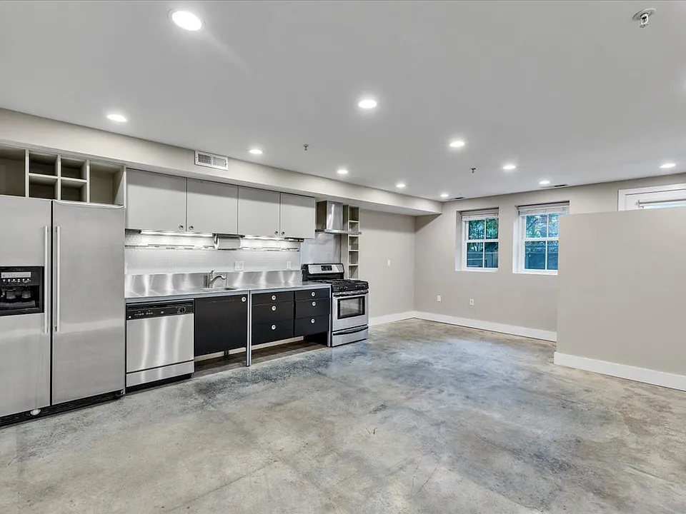 Open floor plan. Kitchen. Dining Area. Living Area.
