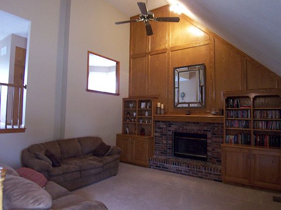 Great Room with fireplace, built-ins and vaulted ceiling