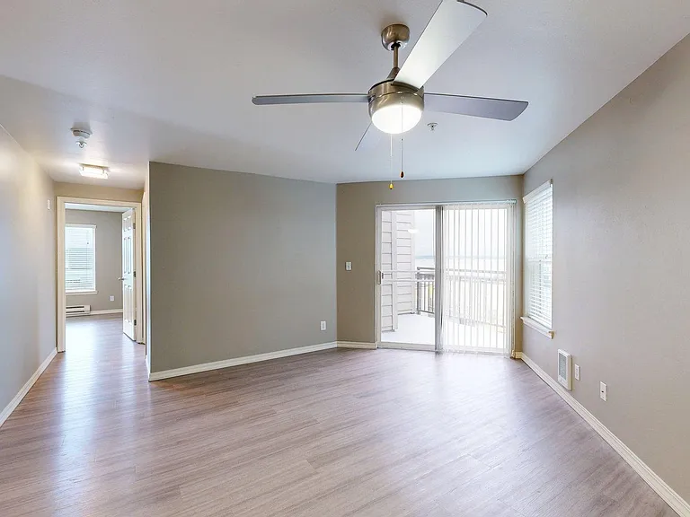 Apartment living room with wood-style flooring.