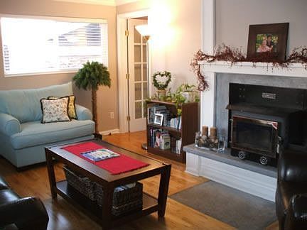 Living Room with Hardwood Floor and Wood Stove