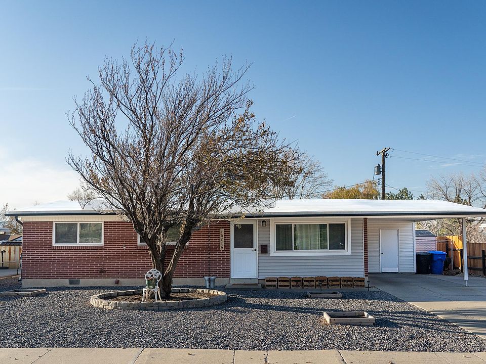 Xeriscape front yard with plum tree
